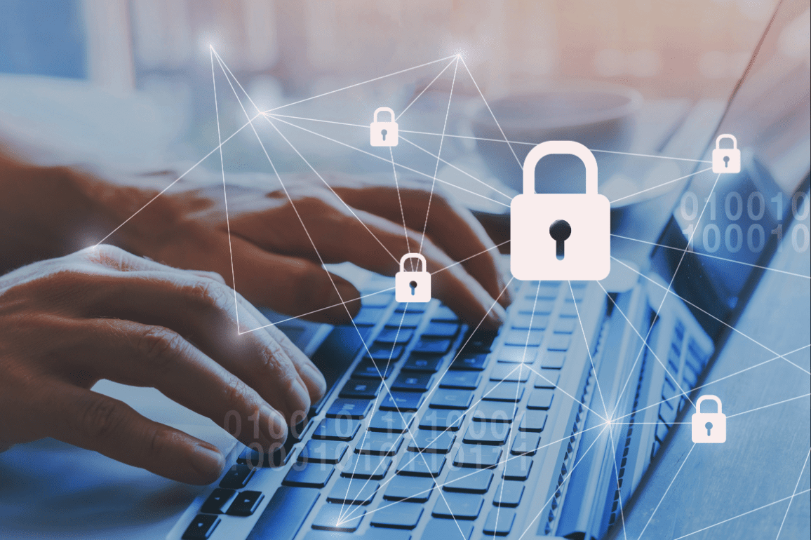GettyImages-1061357610 Hands typing on keyboard with security icons.
